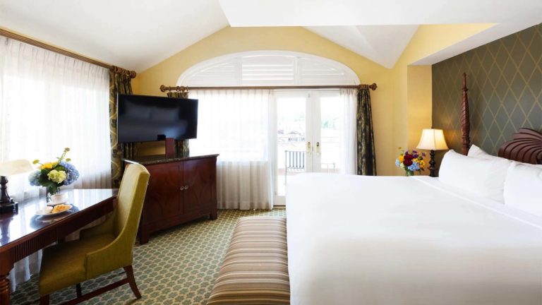 Lodge Parlor Suite - resort room with king bed, workstation, and TV | Nemacolin