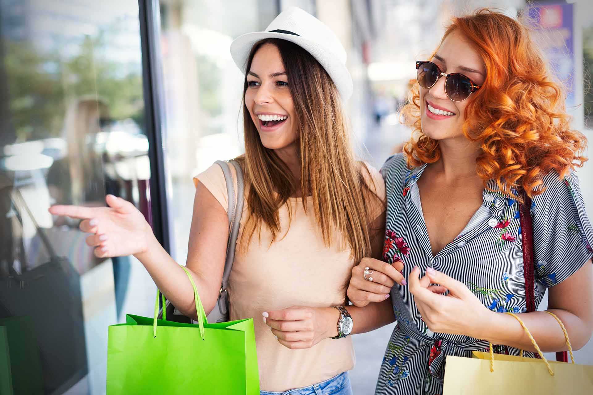 Female friends window shopping