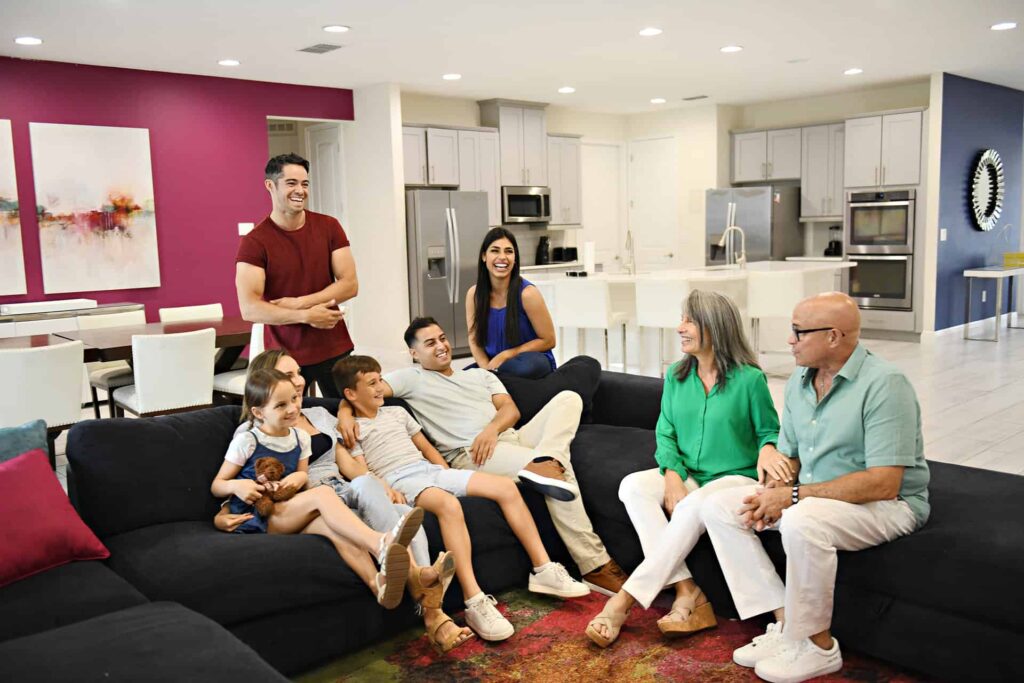 Large multigenerational family gathered together in the living room of an Encore Resort home
