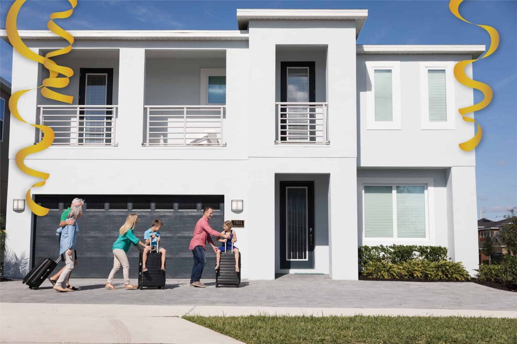 Family arriving with suitcases at their Encore Resort luxury vacation home