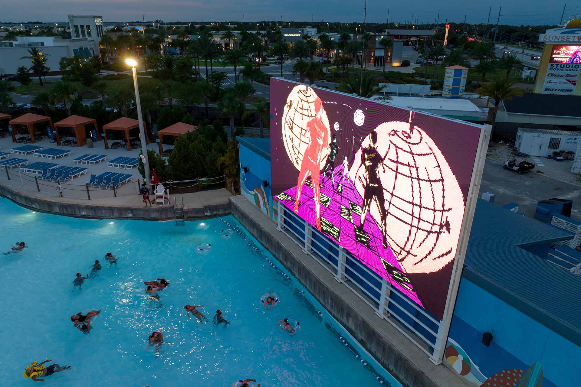 Aerial view of people the wave pool at Island H2O Water Park at sundown