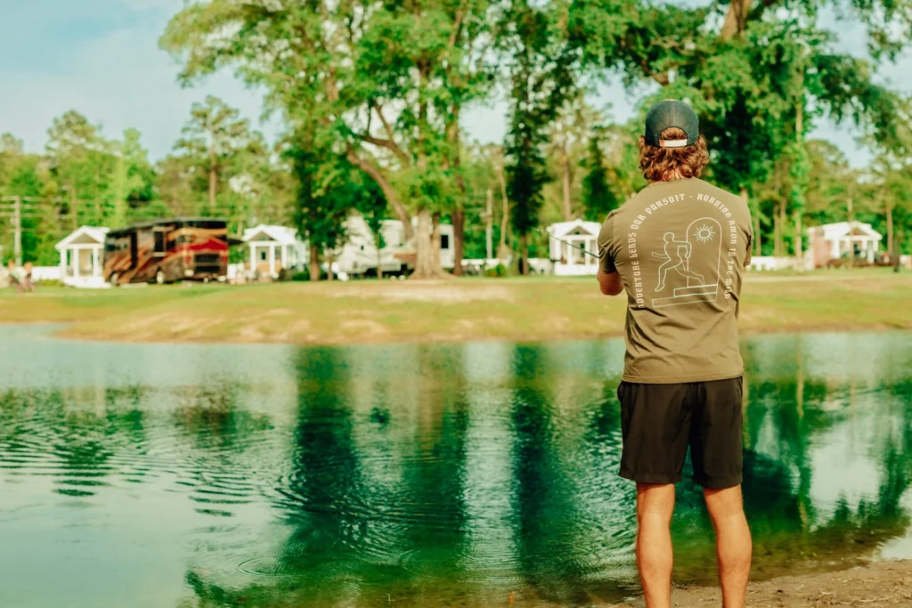 Man fishing in the lake at Island Oaks