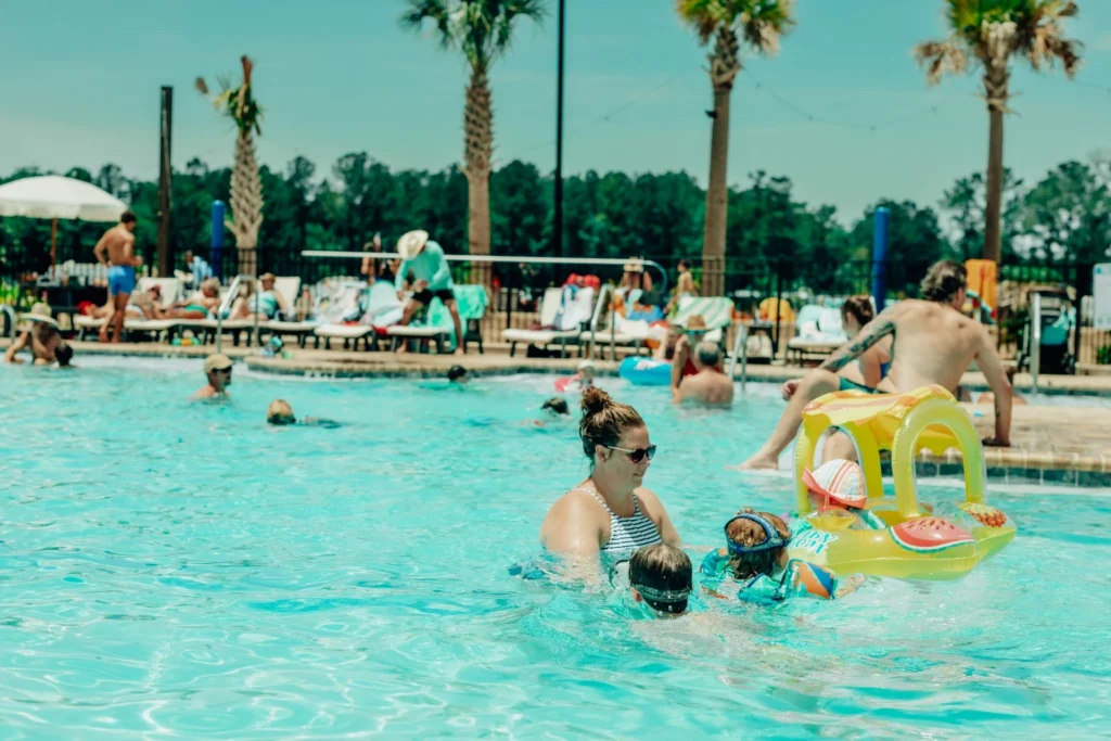 Families swimming and playing in the pool at Island Oaks